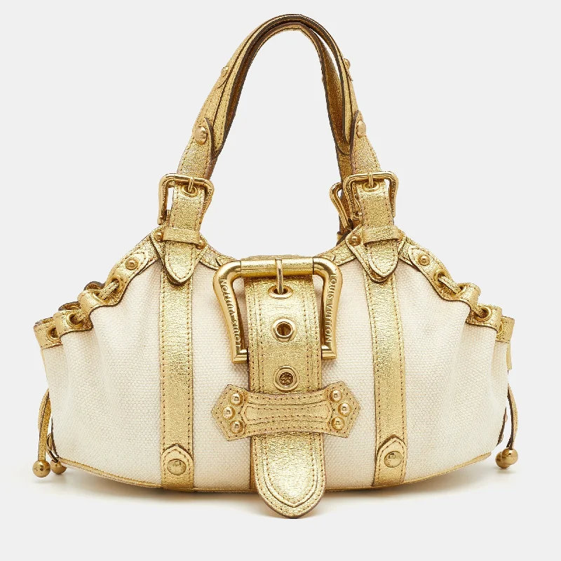 Louis Vuitton Twist bags with a crystal - embellished LV - turnlockLouis Vuitton Cream/Gold Canvas and Leather Antigua Theda PM Bag