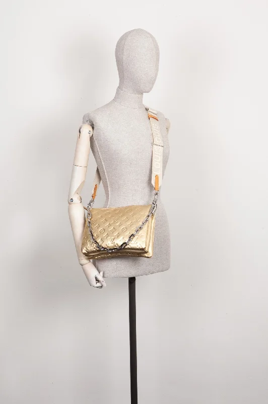 Louis Vuitton handbags with a beaded trim for a touch of glamourLOUIS VUITTON Coussin PM Gold