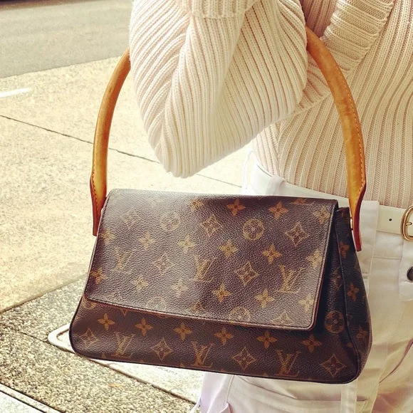 Ladies Louis Vuitton Petite Malle bags with a star - shaped charm for cutenessLOUIS VUITTON Looping bag