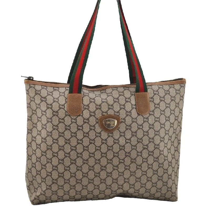 Women Gucci Sylvie bags with a crystal - embellished web stripeAuthentic GUCCI Web Sherry Line GG Plus GG PVC Leather Tote Bag Brown 3769I